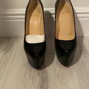 Christian Louboutin Daffodile. Black leather, red soles.